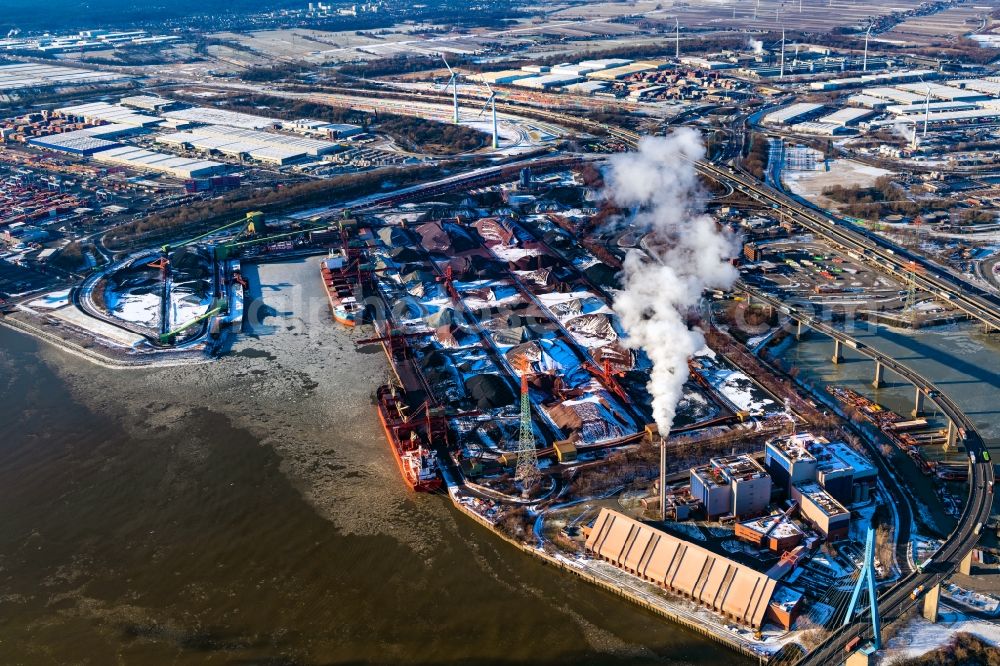 Hamburg from above - Wintry snowy loading zone for sand and bulk material in the harbour and refuse utilisation facility MVR Muellverwertung Rugenberger Damm GmbH & Co. KG at the Koehlbrandbruecke in Hamburg