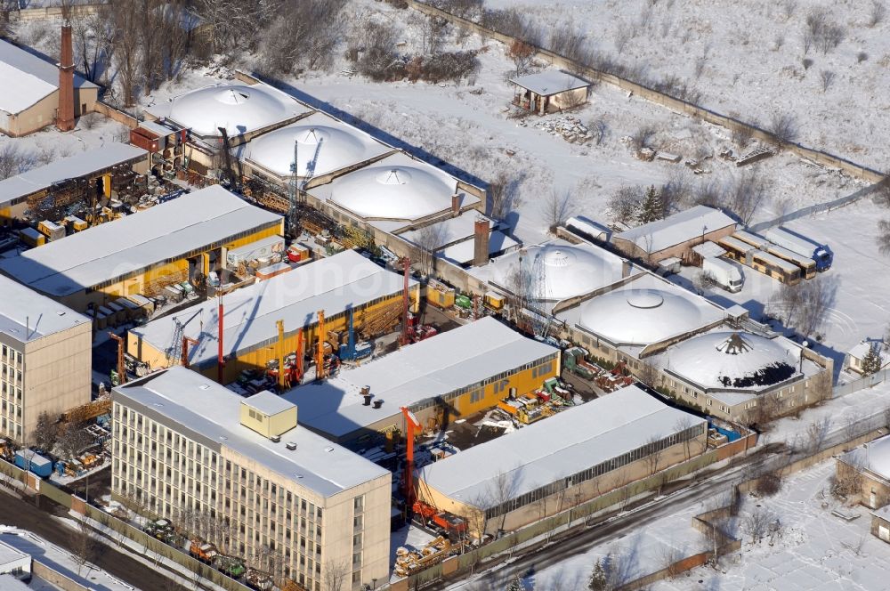 Aerial image Berlin - Wintry snowy site of the depot of the of BORAMTEC Bohr & Rammtechnik Berlin GmbH on Koepenicker Allee in the district Karlshorst in Berlin, Germany