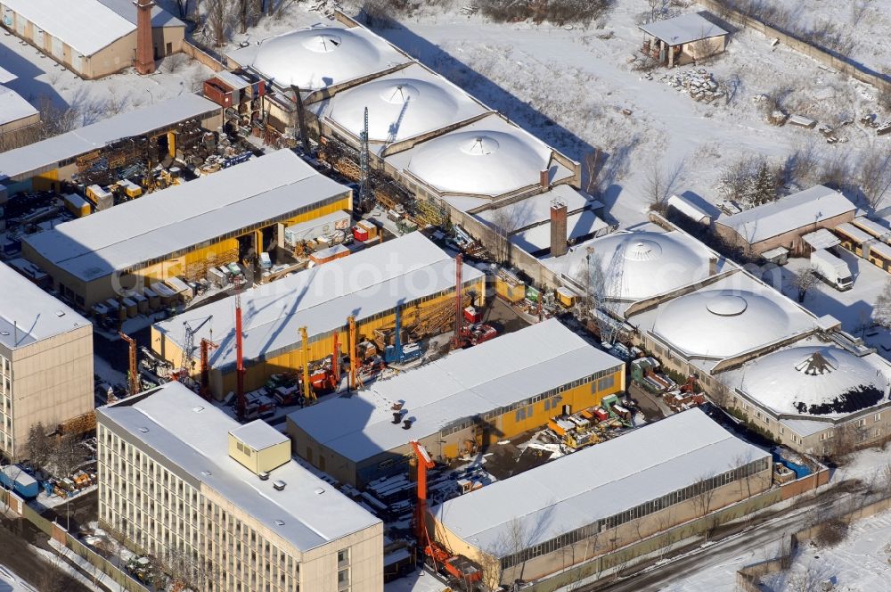 Aerial photograph Berlin - Wintry snowy site of the depot of the of BORAMTEC Bohr & Rammtechnik Berlin GmbH on Koepenicker Allee in the district Karlshorst in Berlin, Germany