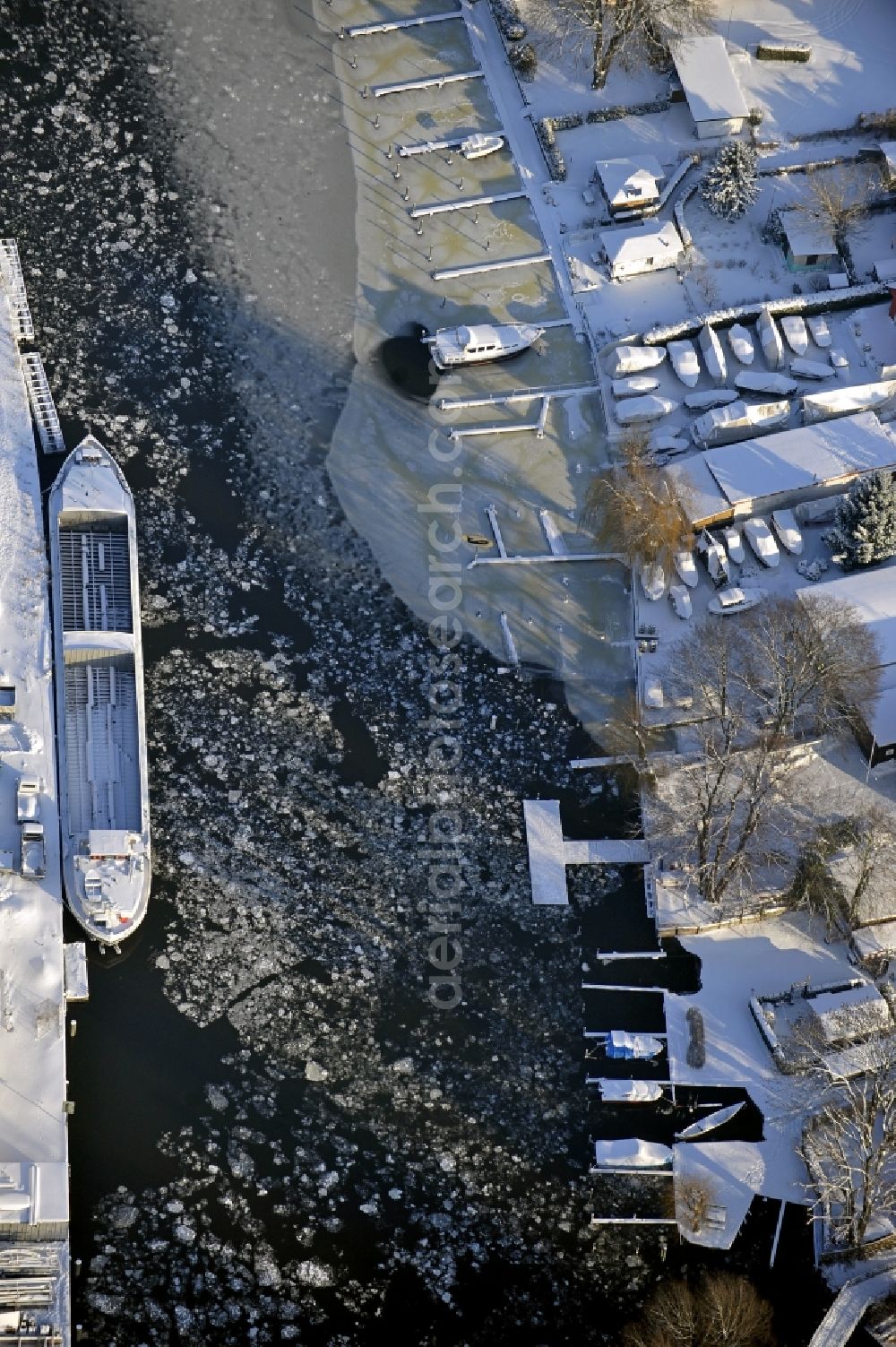 Berlin from above - Wintry snowy wharves and piers with ship loading terminals in the inner harbor Suedhafen on the Havel river in the district Spandau in Berlin, Germany