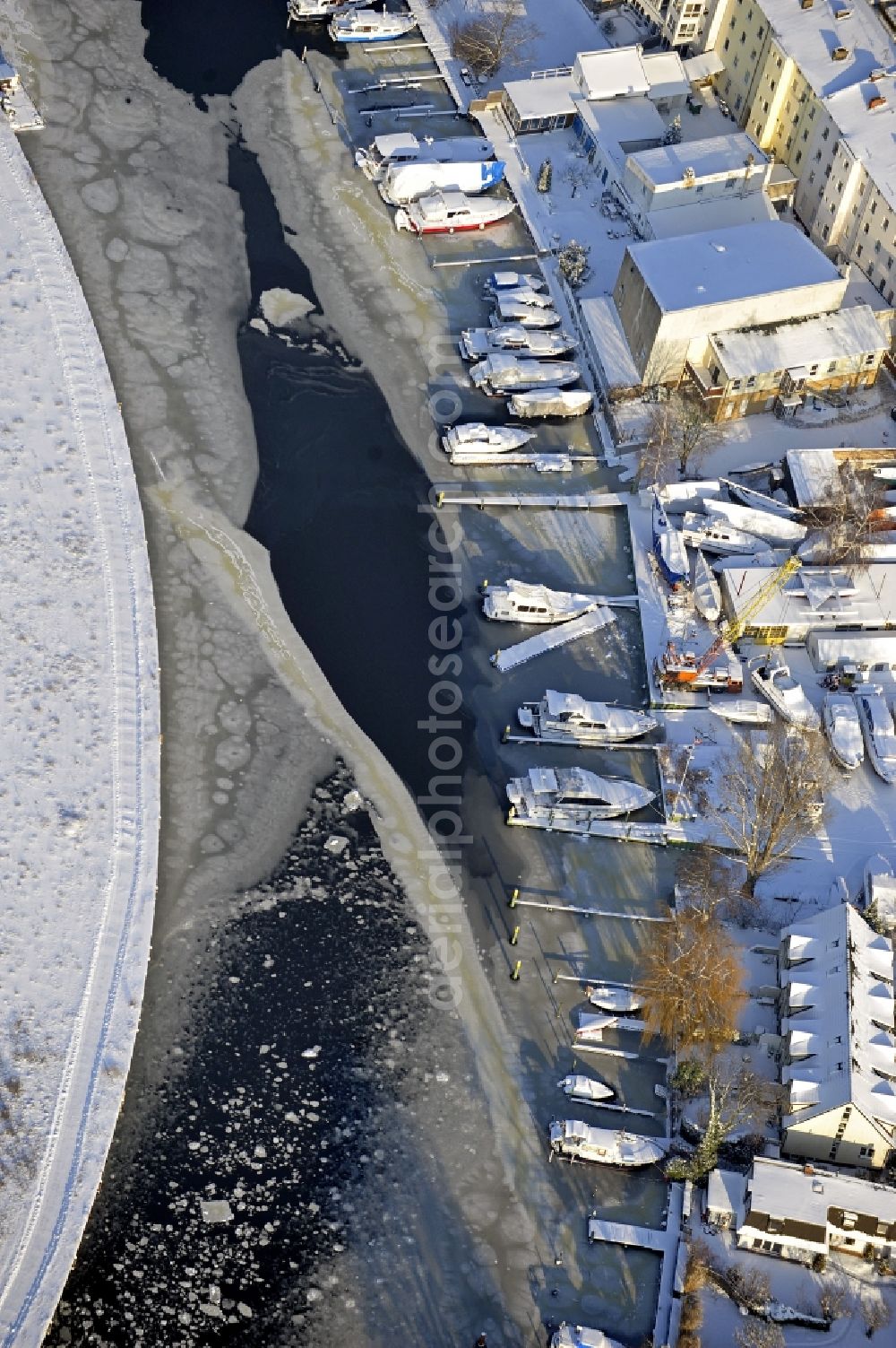 Berlin from above - Wintry snowy wharves and piers with ship loading terminals in the inner harbor Suedhafen on the Havel river in the district Spandau in Berlin, Germany