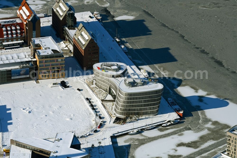 Rostock from the bird's eye view: Wintry snowy office building AIDA Cruises - German Branch of Costa Crociere S.p.A. in Rostock in the state Mecklenburg - Western Pomerania, Germany