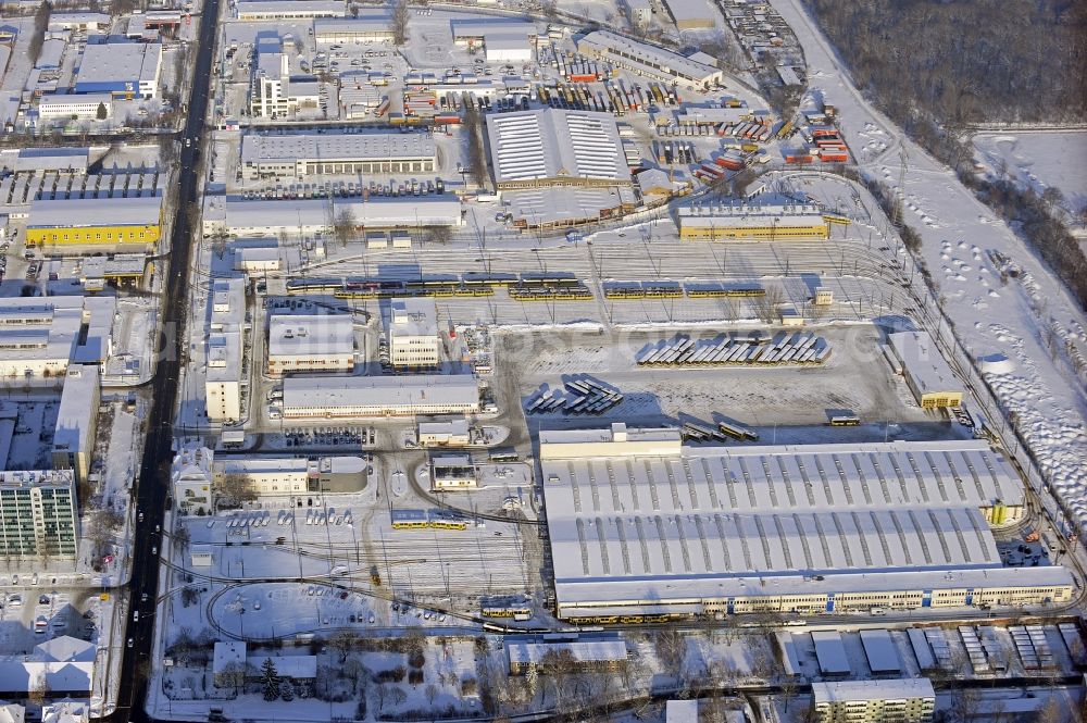 Berlin from the bird's eye view: Wintry snowy bVG bus and train station in the district Lichtenberg in Berlin