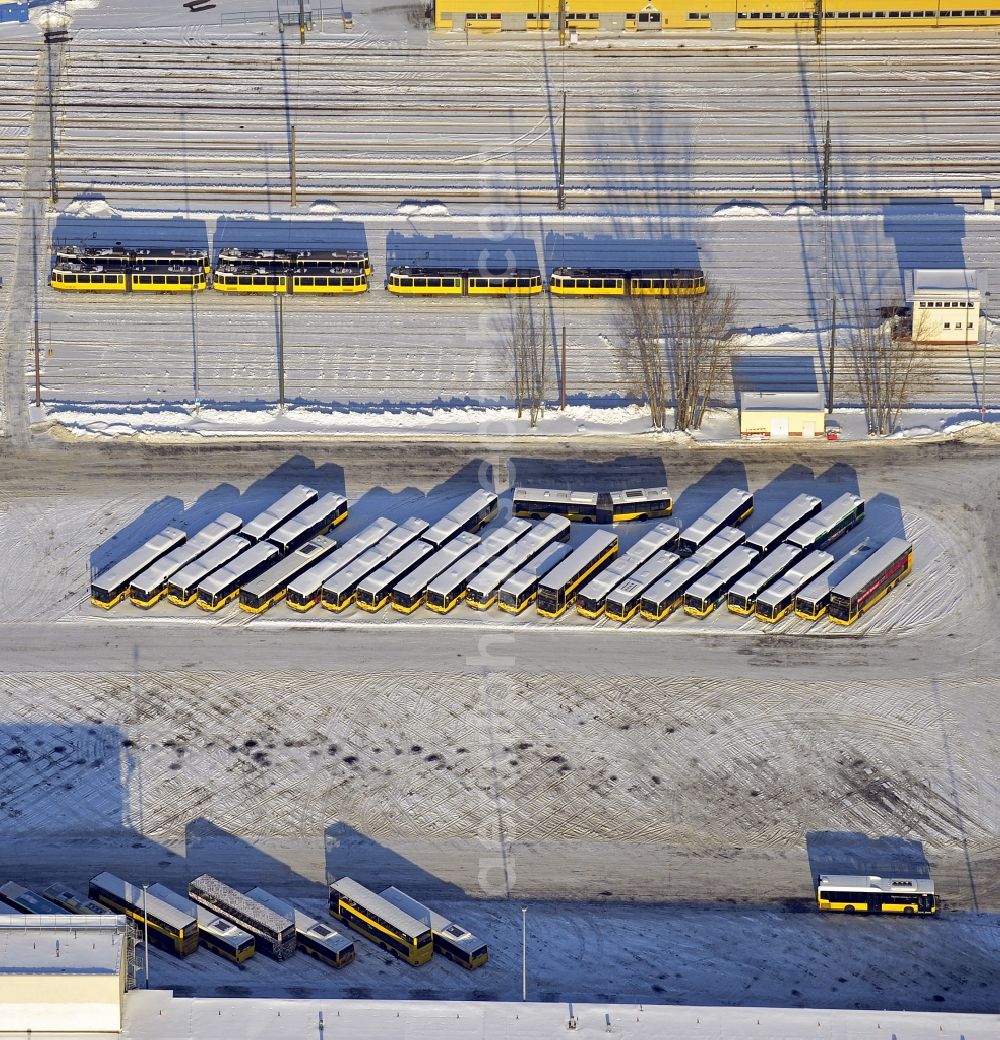 Aerial image Berlin - Wintry snowy bVG bus and train station in the district Lichtenberg in Berlin