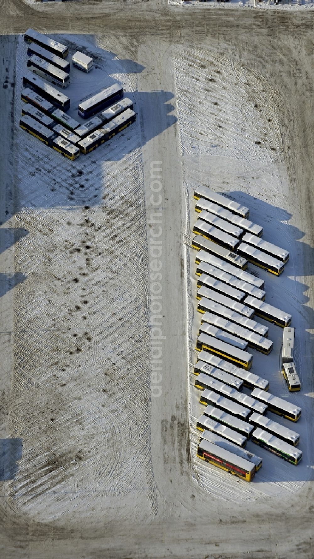 Aerial image Berlin - Wintry snowy bVG bus and train station in the district Lichtenberg in Berlin