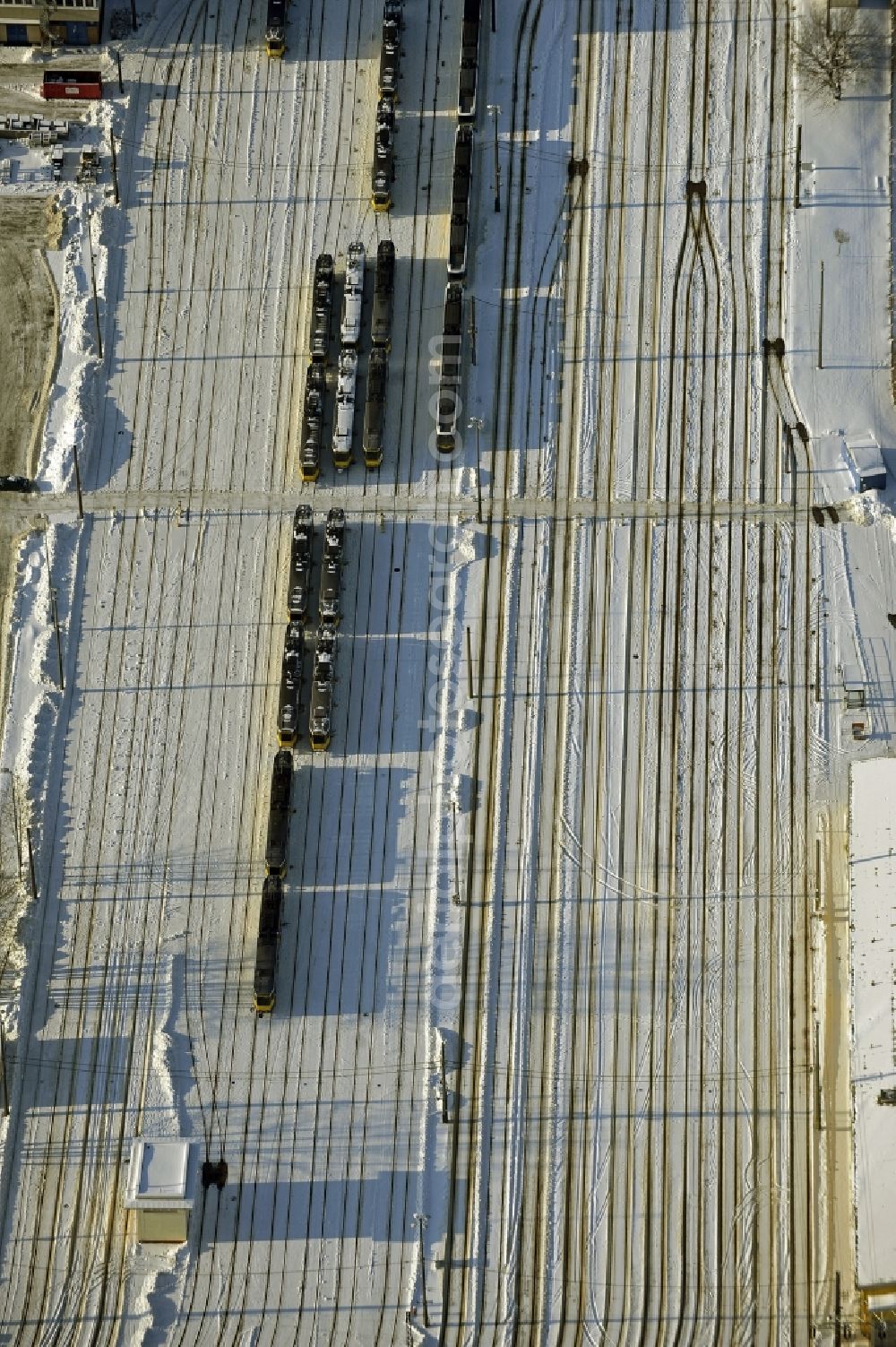 Berlin from above - Wintry snowy bVG bus and train station in the district Lichtenberg in Berlin