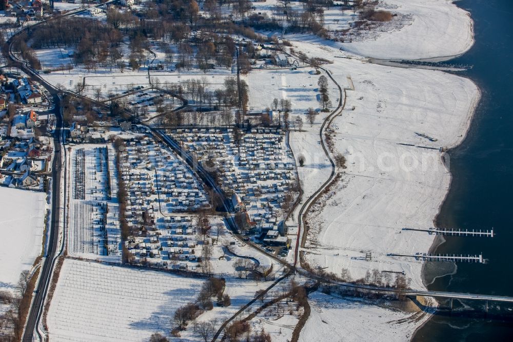 Möhnesee from above - The wintry snowy camping place Brock Rolf by caravan in the district of Koerbecke in Moehnesee in the federal state North Rhine-Westphalia