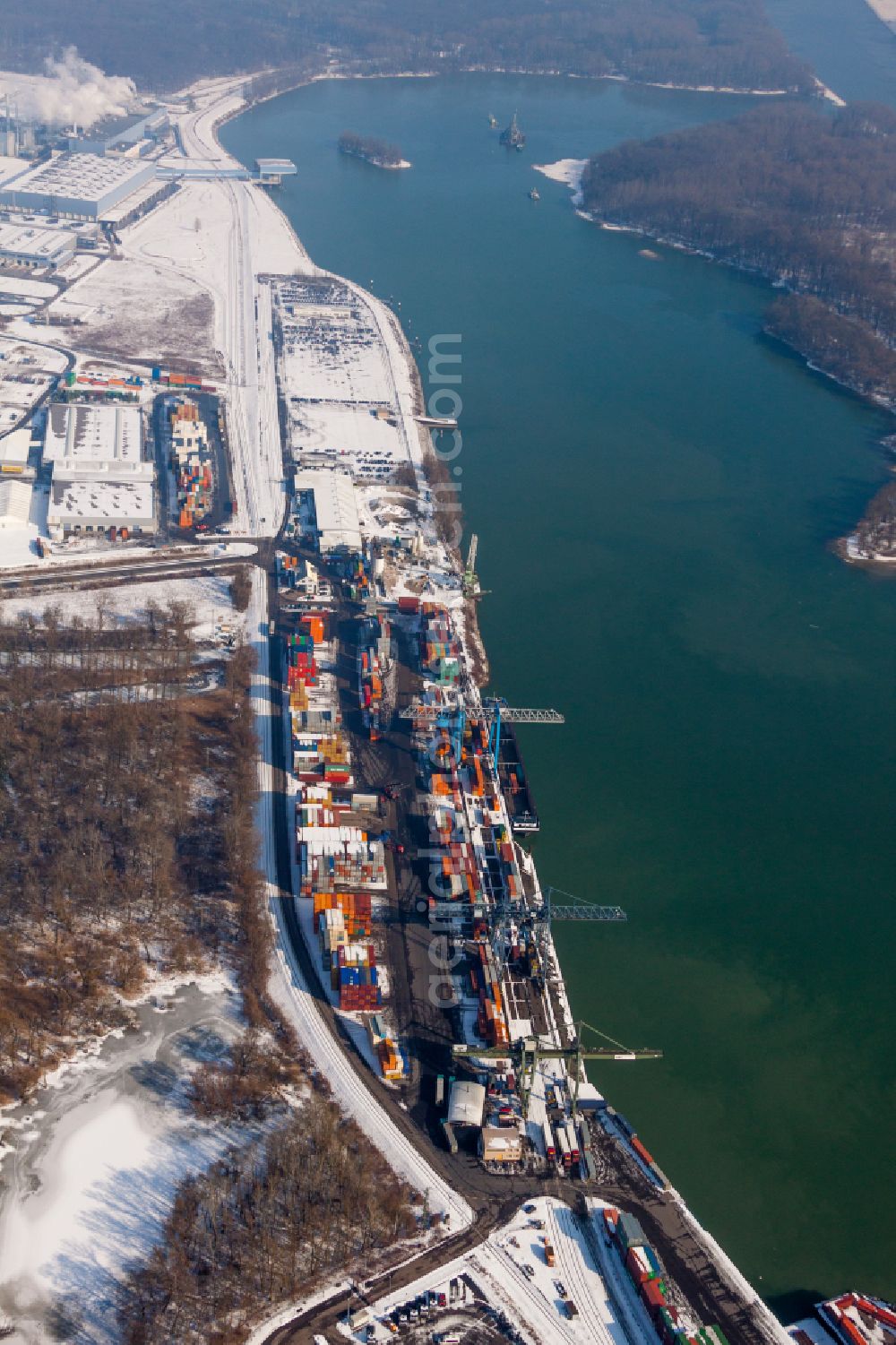 Aerial photograph Wörth am Rhein - Wintry snowy Container terminal in the container port of Contargo Woerth-Karlsruhe GmbH on the lake of the Landeshafen in the district Industriegebiet Woerth-Oberwald in Woerth am Rhein in the state Rhineland-Palatinate, Germany