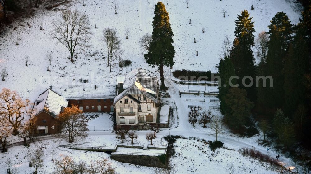 Königswinter from the bird's eye view: Wintry snowy view listed Courtyard in Koenigswinter in the state North Rhine-Westphalia, Germany