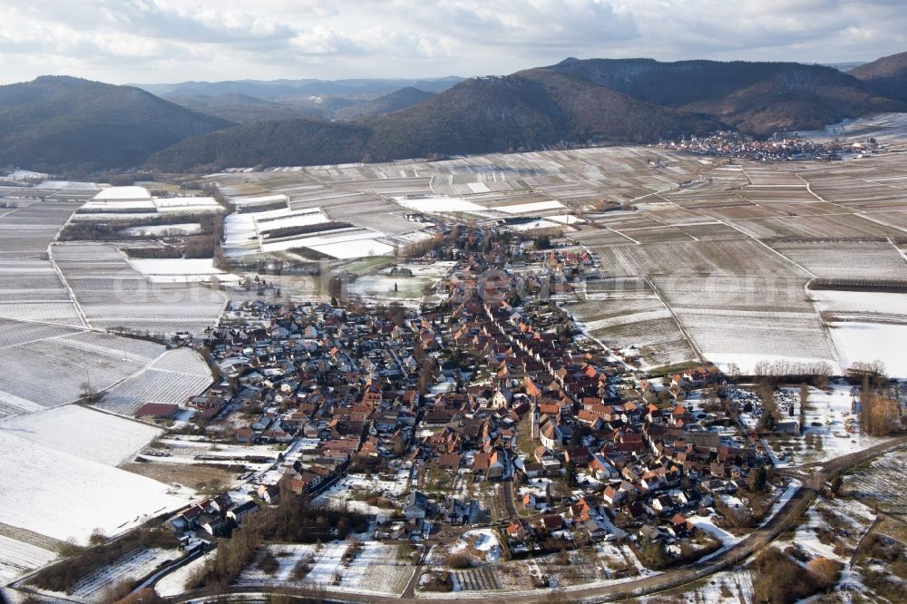 Göcklingen from the bird's eye view: Wintry snowy Village view in Goecklingen in the state Rhineland-Palatinate, Germany