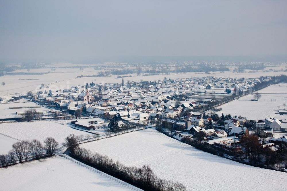 Aerial photograph Neupotz - Wintry snowy Village - view on the edge of agricultural fields and farmland in Neupotz in the state Rhineland-Palatinate