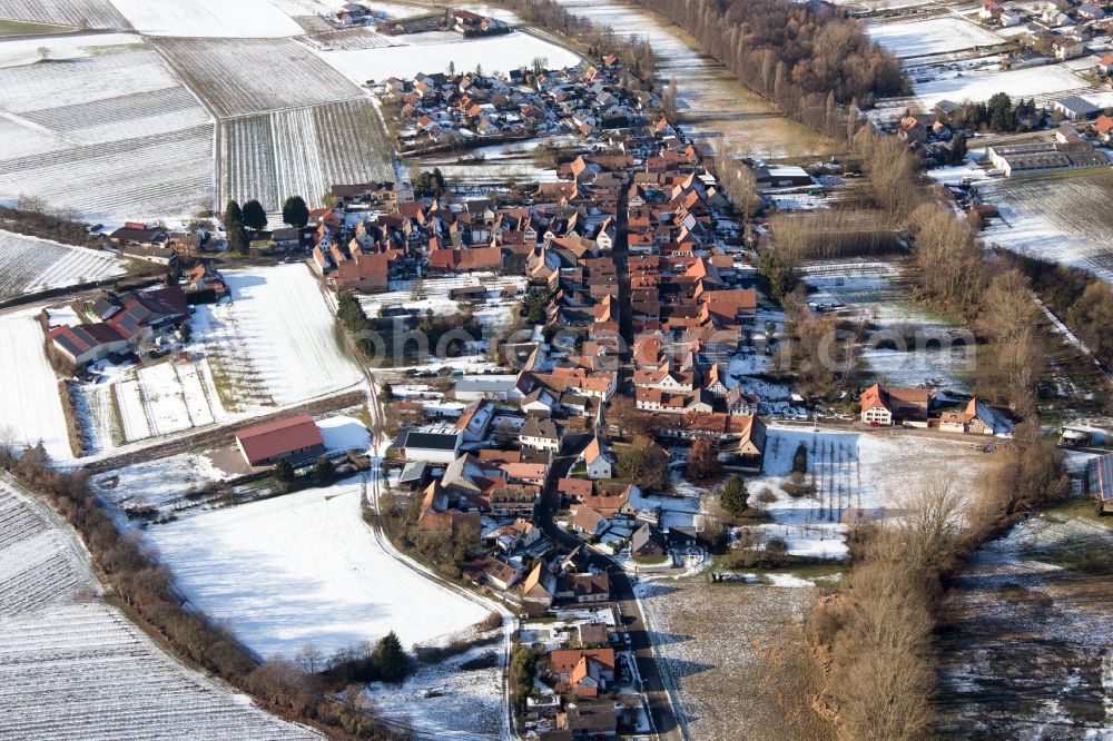 Heuchelheim-Klingen from above - Wintry snowy Village - view on the edge of agricultural fields and farmland in the district Heuchelheim in Heuchelheim-Klingen in the state Rhineland-Palatinate, Germany