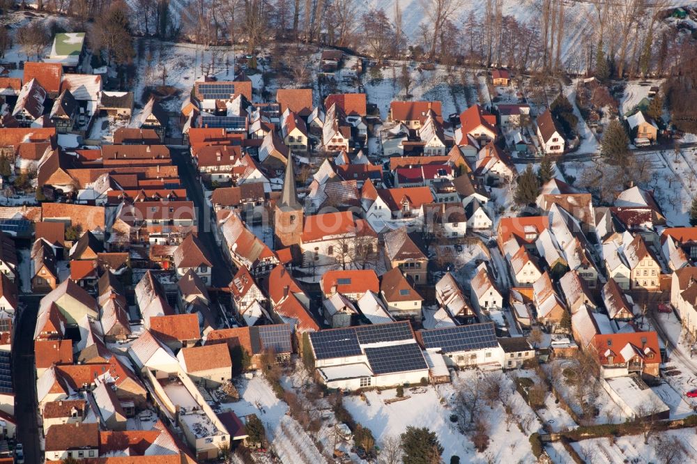 Aerial image Heuchelheim-Klingen - Wintry snowy Village - view on the edge of agricultural fields and farmland in the district Heuchelheim in Heuchelheim-Klingen in the state Rhineland-Palatinate, Germany