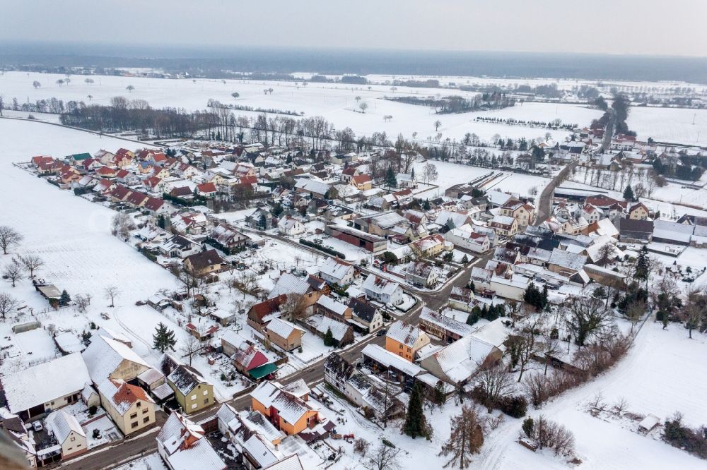 Niederotterbach from above - Wintry snowy Village - view on the edge of agricultural fields and farmland in the district Kleinsteinfeld in Niederotterbach in the state Rhineland-Palatinate, Germany