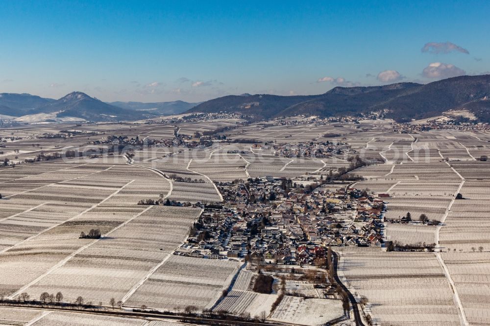 Aerial photograph Roschbach - Wintry snowy village - view on the edge of agricultural fields and farmland in Roschbach in the state Rhineland-Palatinate, Germany