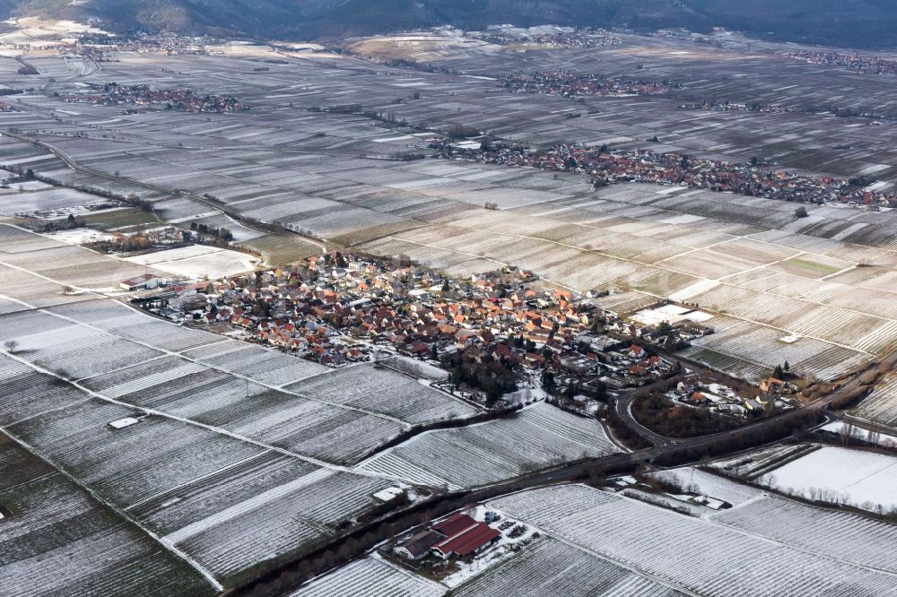 Walsheim from above - Wintry snowy Village - view on the edge of agricultural fields and farmland in Walsheim in the state Rhineland-Palatinate, Germany