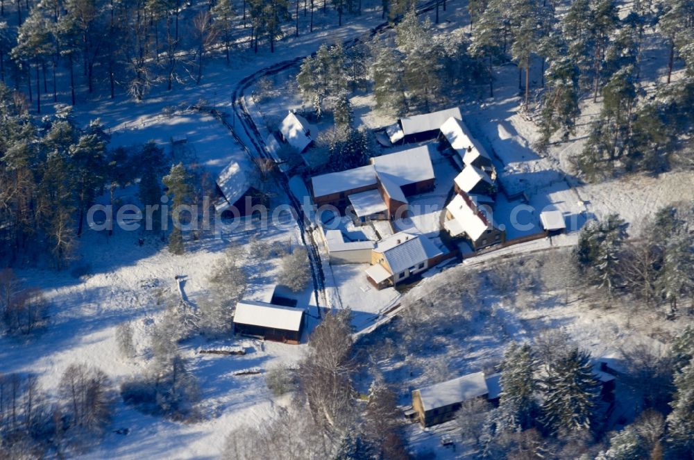 Aerial image Hohenspringe - Wintry snowy village - view on the edge of forested areas in Hohenspringe in the state Brandenburg, Germany