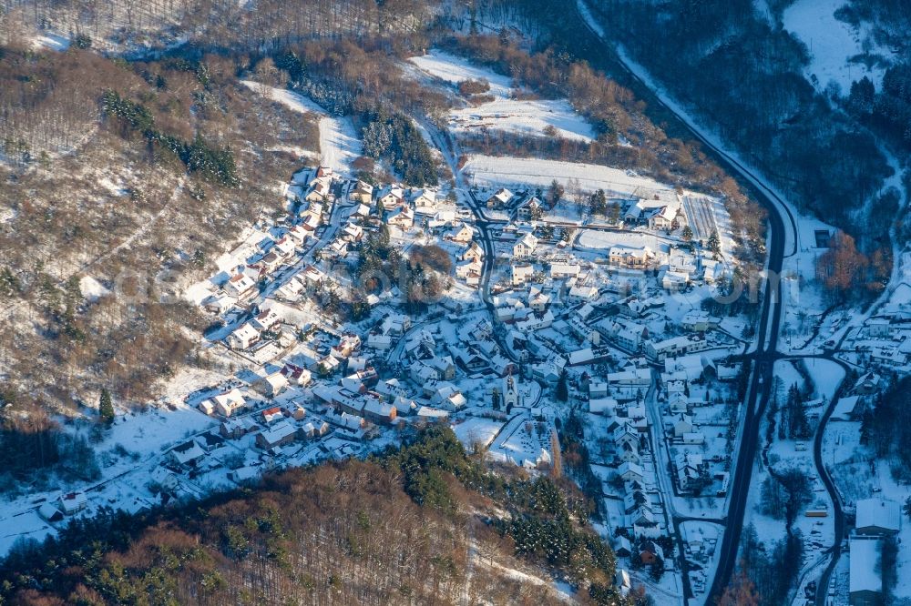 Waldhambach from the bird's eye view: Wintry snowy Village view in Waldhambach in the state Rhineland-Palatinate, Germany