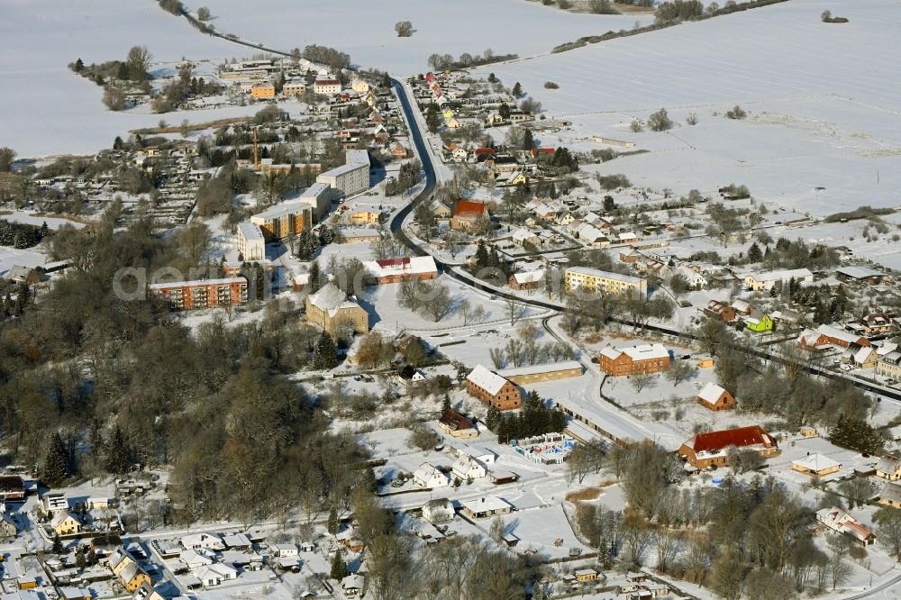 Aerial image Cölpin - Wintry snowy agricultural land and field boundaries surround the settlement area of the village in Coelpin in the state Mecklenburg - Western Pomerania, Germany