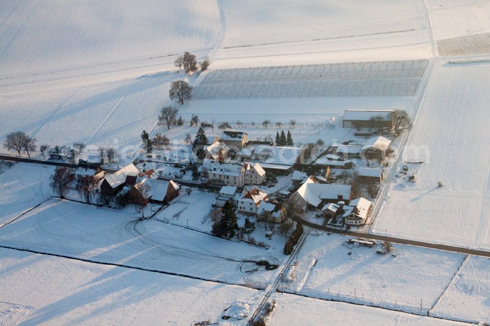 Aerial image Kapellen-Drusweiler - Wintry snowy Panel rows of photovoltaic turnable roof of a stable in the district Deutschhof in Kapellen-Drusweiler in the state Rhineland-Palatinate