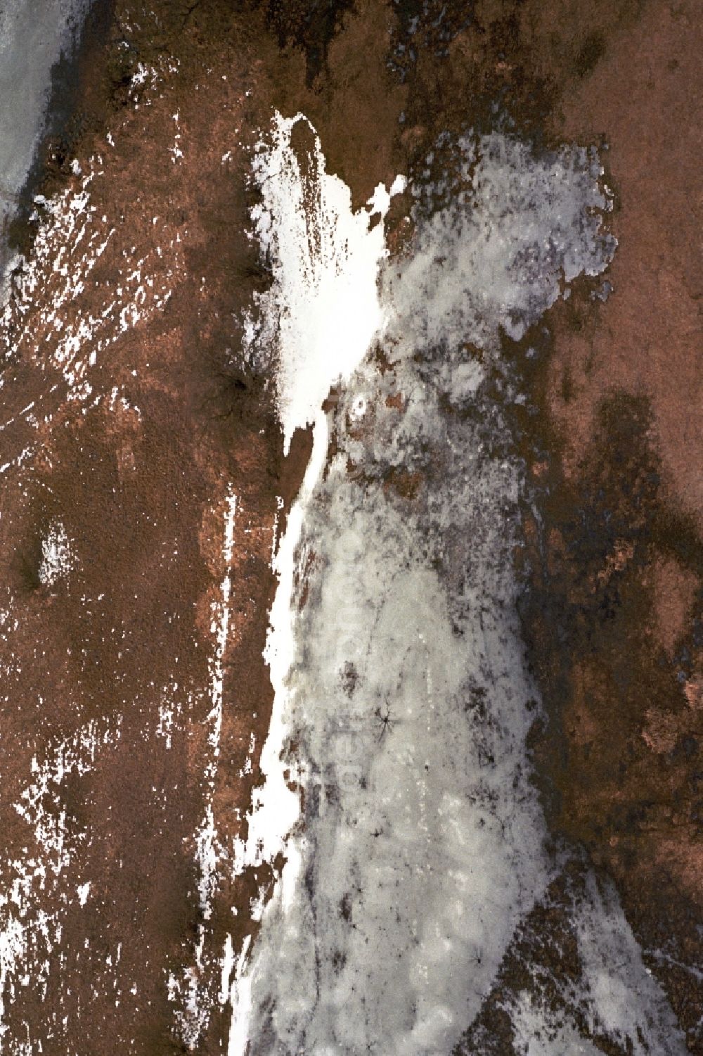 Neutrebbin from above - Wintry snowy Agricultural fields embossed of soil erosion and ice and snow structures in Neutrebbin in the state Brandenburg, Germany