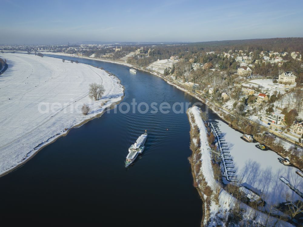 Dresden from the bird's eye view: Winter snow-covered Elbe bank at Loschwitz harbor with Elbe steamer Leipzig in Dresden in the state of Saxony, Germany