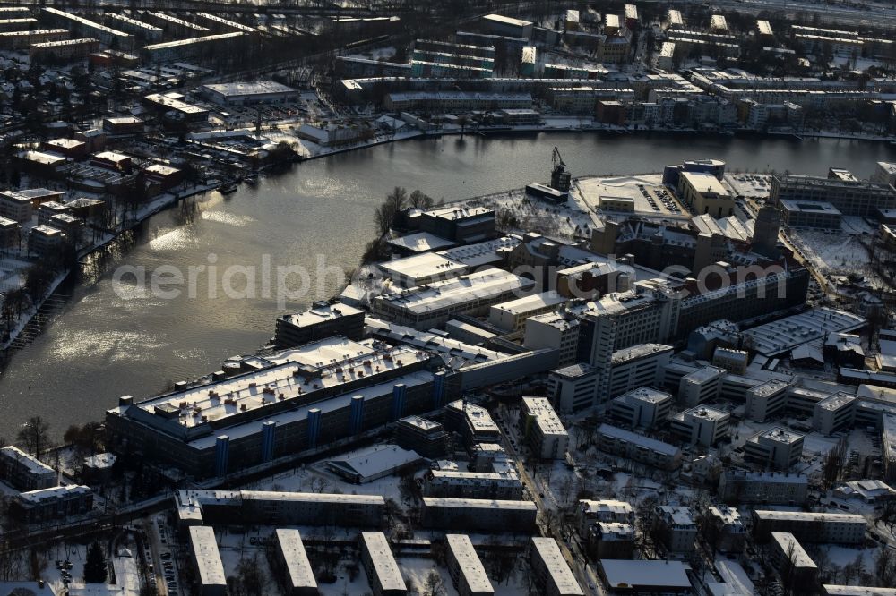 Aerial image Berlin - Wintry snowy development area of former industrial and commercial area Ostendstrasse in the district Oberschoeneweide in Berlin