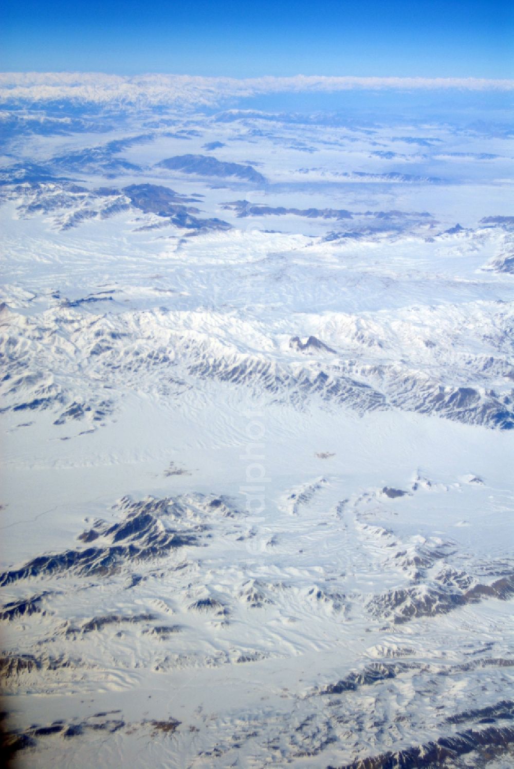 Kandahar from the bird's eye view: Wintry snowy rock and mountain landscape Hindu Kush in Kandahar in Afghanistan