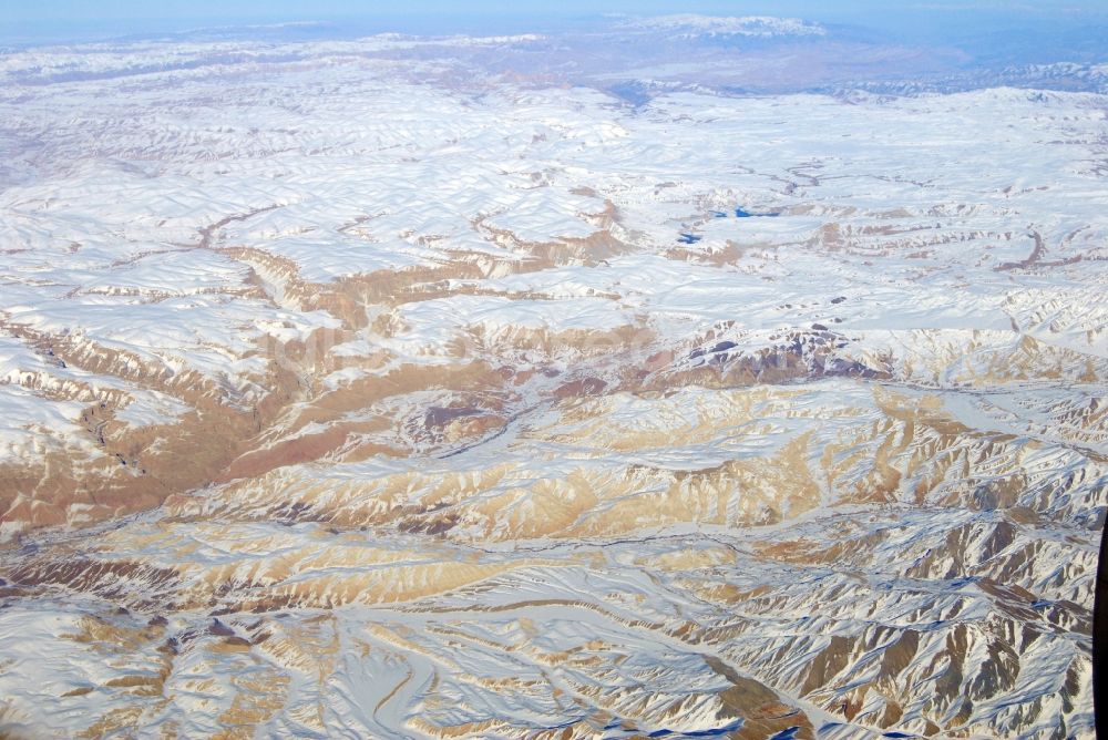 Aerial photograph Kandahar - Wintry snowy rock and mountain landscape Hindu Kush in Kandahar in Afghanistan