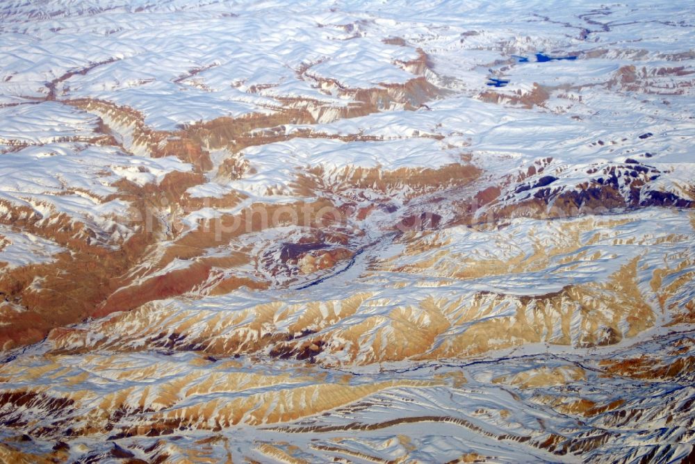 Kandahar from above - Wintry snowy rock and mountain landscape Hindu Kush in Kandahar in Afghanistan