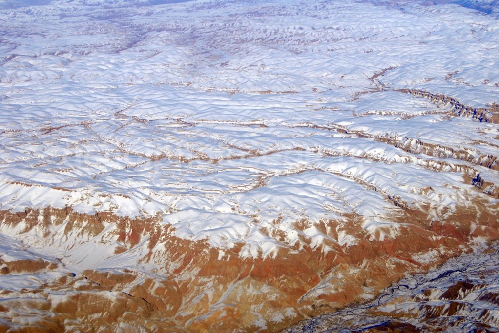 Kandahar from the bird's eye view: Wintry snowy rock and mountain landscape Hindu Kush in Kandahar in Afghanistan