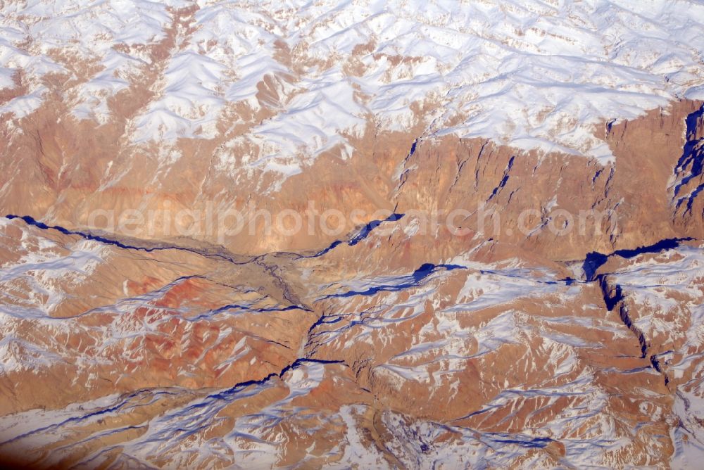 Aerial photograph Kandahar - Wintry snowy rock and mountain landscape Hindu Kush in Kandahar in Afghanistan