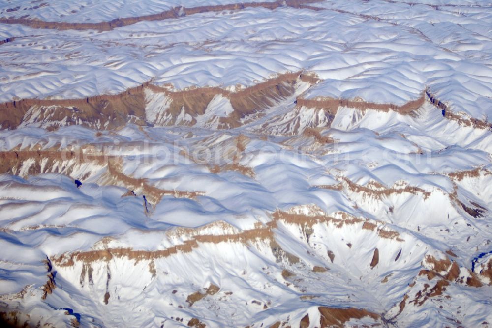 Kandahar from above - Wintry snowy rock and mountain landscape Hindu Kush in Kandahar in Afghanistan