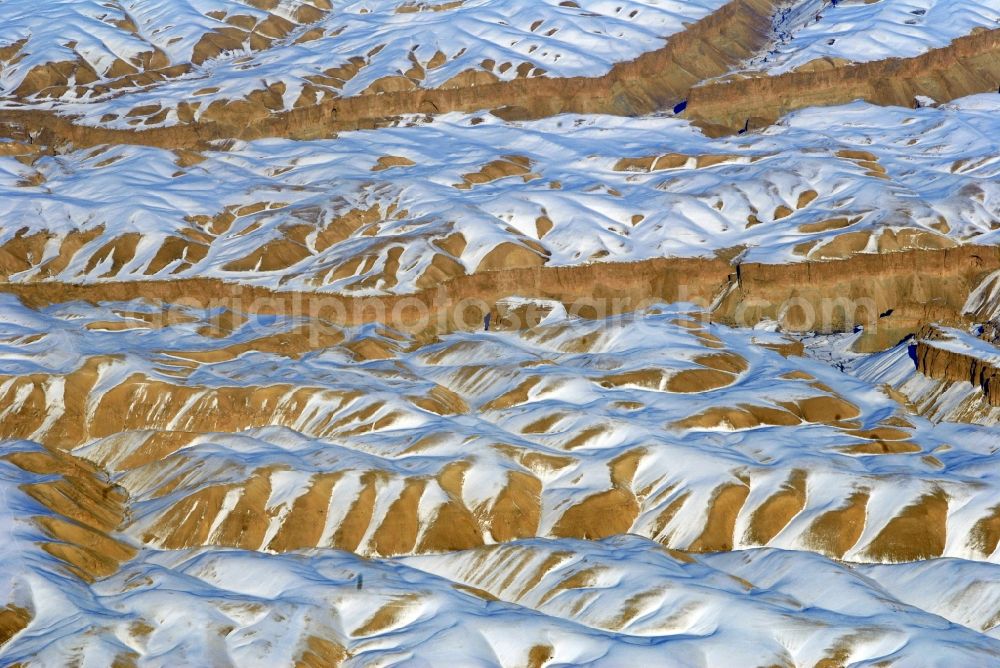 Kandahar from the bird's eye view: Wintry snowy rock and mountain landscape Hindu Kush in Kandahar in Afghanistan