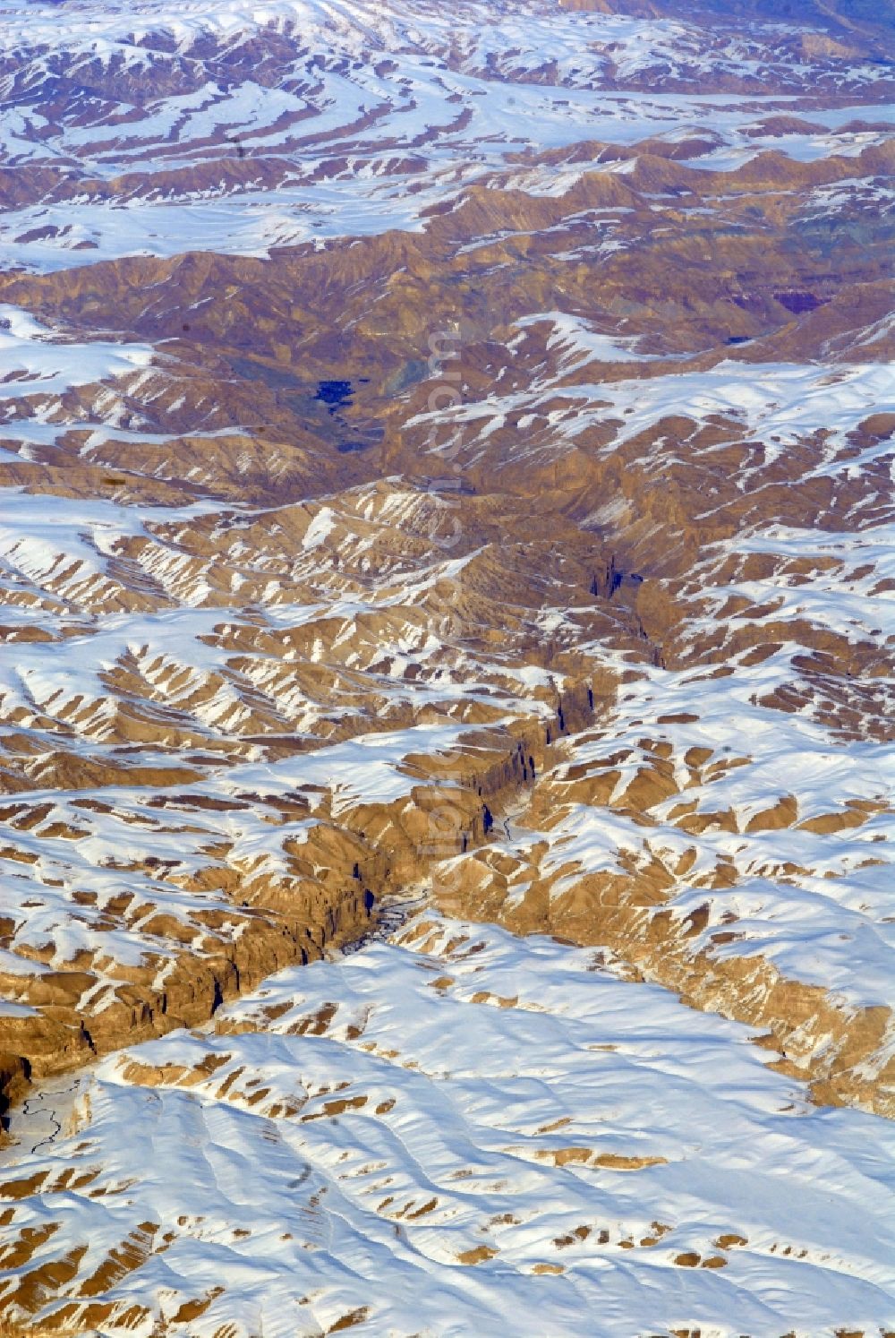 Kandahar from the bird's eye view: Wintry snowy rock and mountain landscape Hindu Kush in Kandahar in Afghanistan