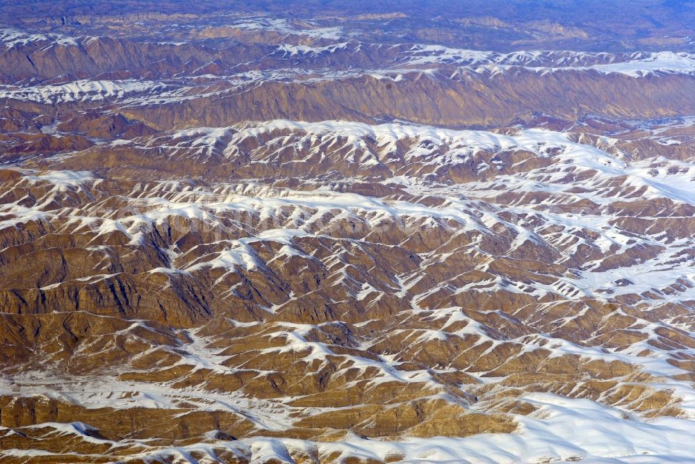 Aerial photograph Kandahar - Wintry snowy rock and mountain landscape Hindu Kush in Kandahar in Afghanistan