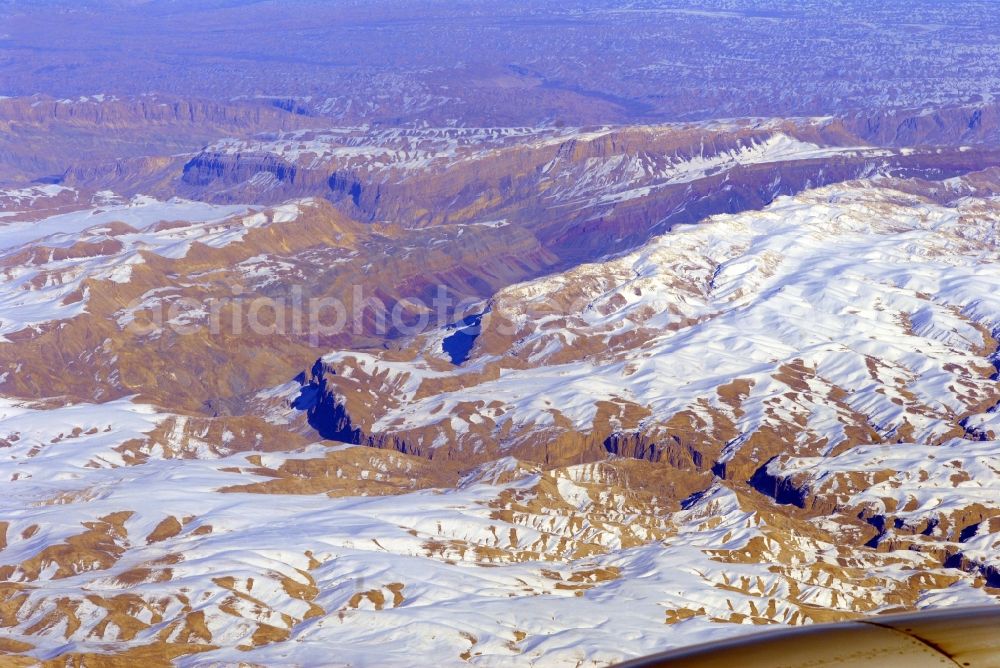 Kandahar from above - Wintry snowy rock and mountain landscape Hindu Kush in Kandahar in Afghanistan