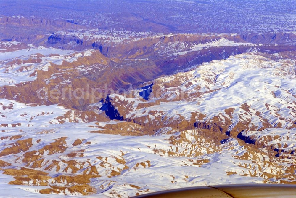 Kandahar from the bird's eye view: Wintry snowy rock and mountain landscape Hindu Kush in Kandahar in Afghanistan