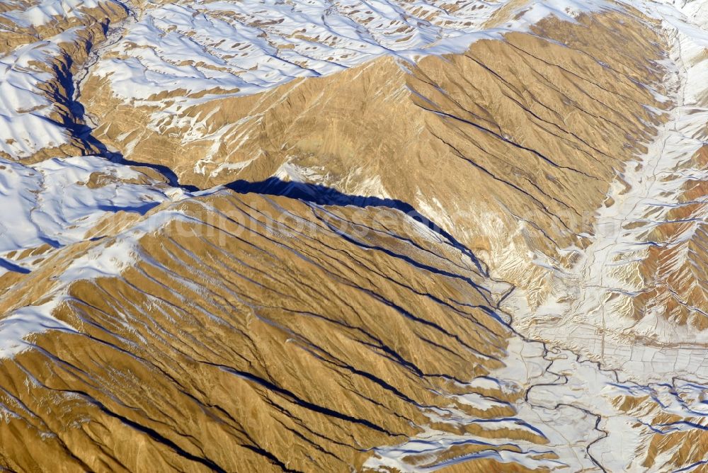 Aerial photograph Kandahar - Wintry snowy rock and mountain landscape Hindu Kush in Kandahar in Afghanistan