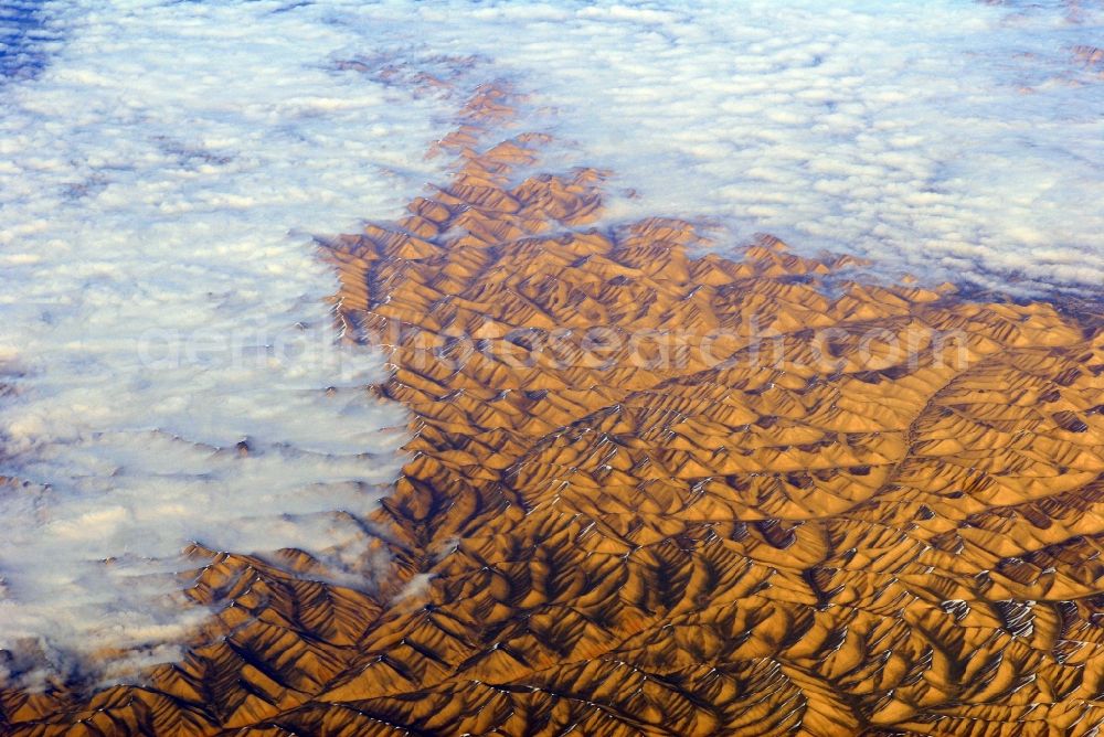 Kandahar from the bird's eye view: Wintry snowy rock and mountain landscape Hindu Kush in Kandahar in Afghanistan