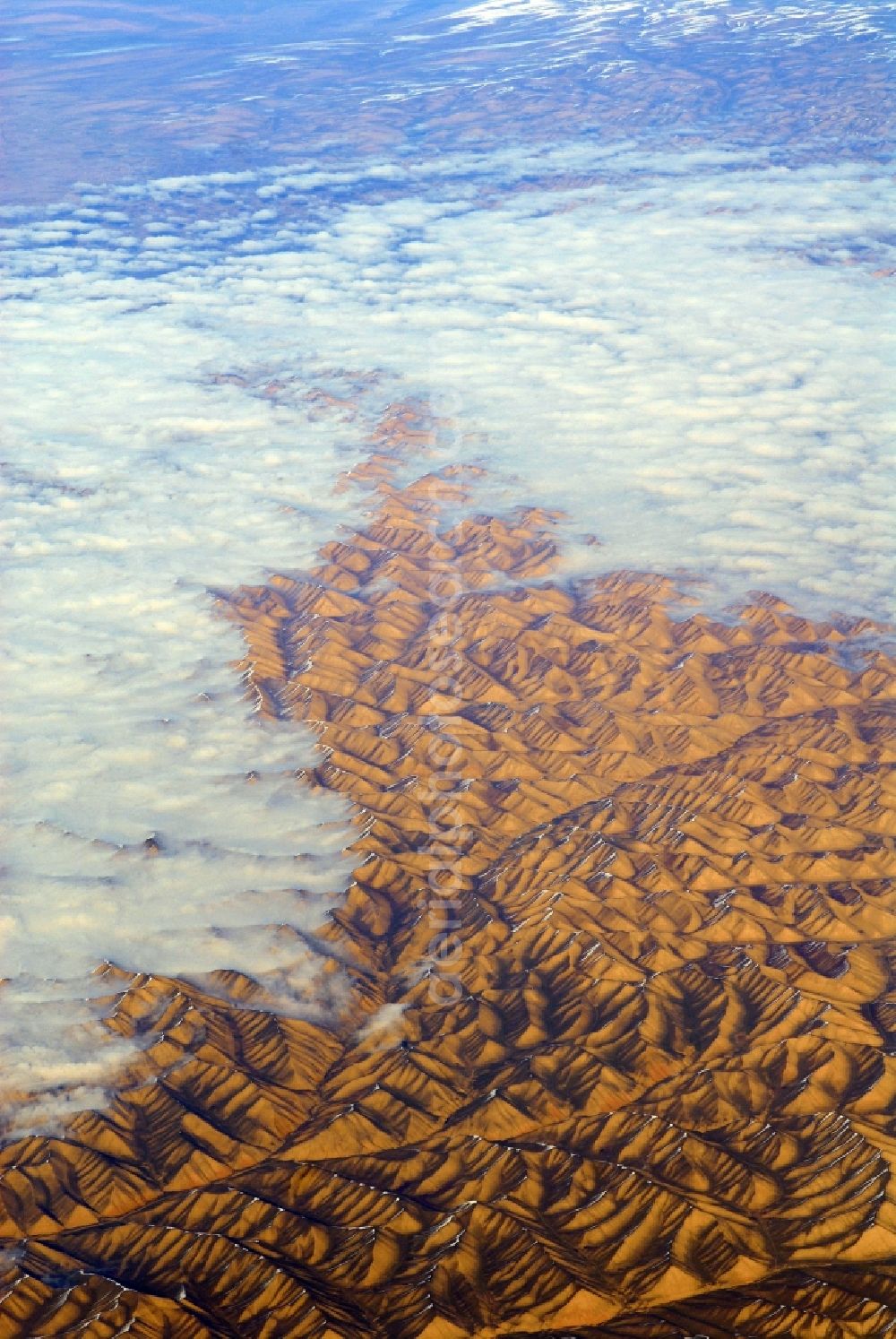 Aerial image Kandahar - Wintry snowy rock and mountain landscape Hindu Kush in Kandahar in Afghanistan