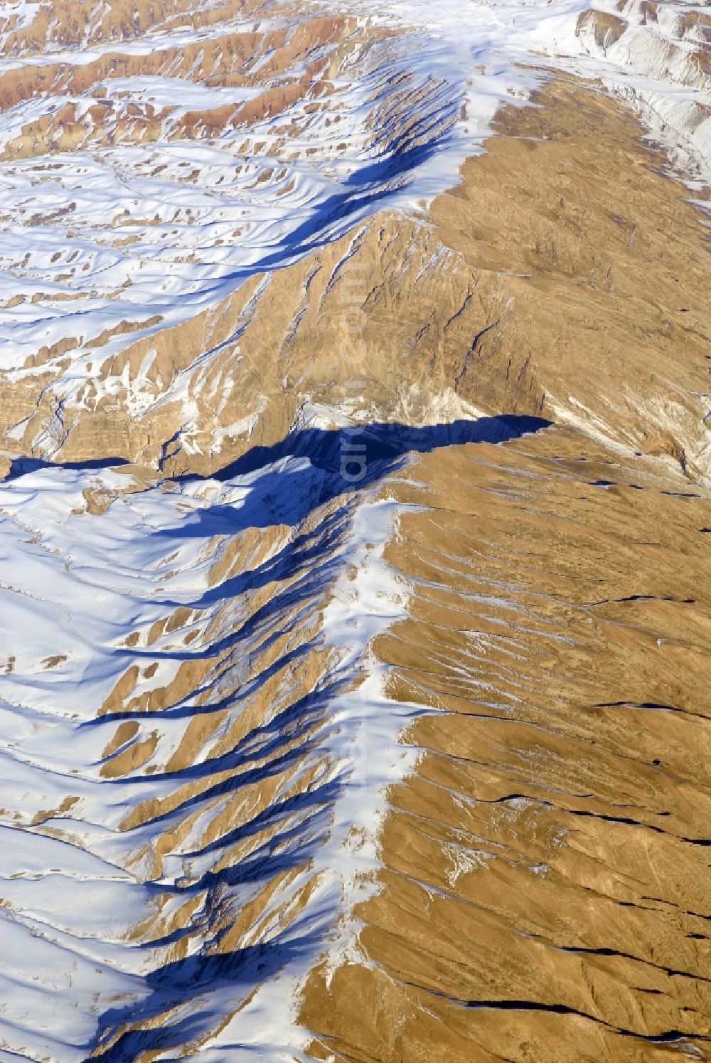 Kandahar from the bird's eye view: Wintry snowy rock and mountain landscape Hindu Kush in Kandahar in Afghanistan