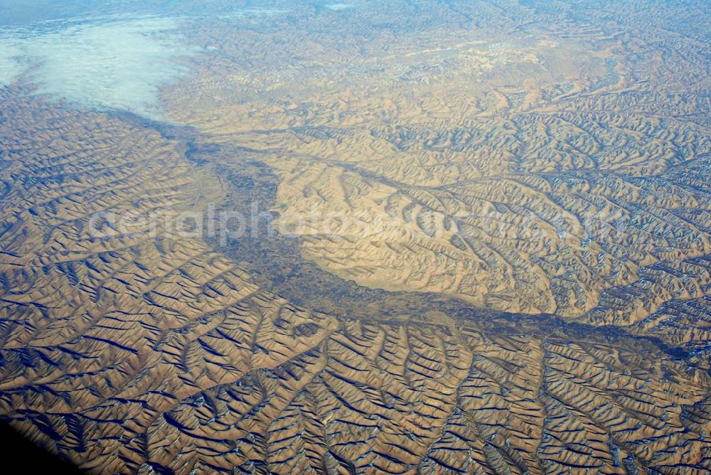 Kandahar from above - Wintry snowy rock and mountain landscape Hindu Kush in Kandahar in Afghanistan