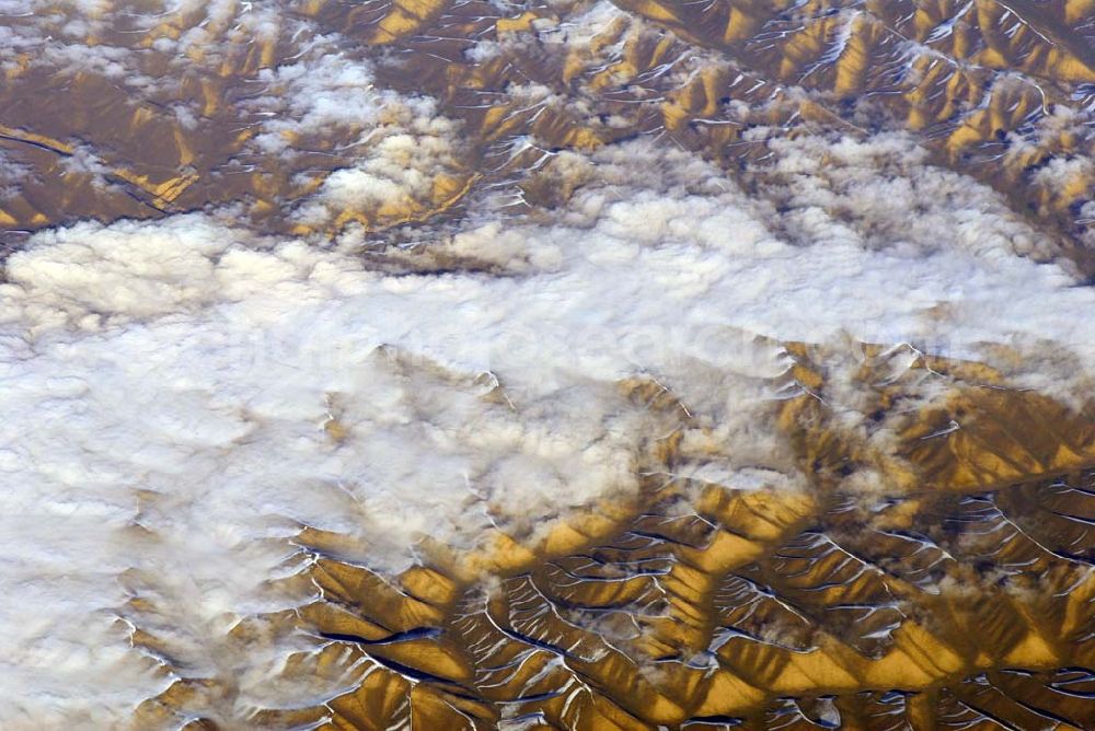 Kandahar from the bird's eye view: Wintry snowy rock and mountain landscape Hindu Kush in Kandahar in Afghanistan