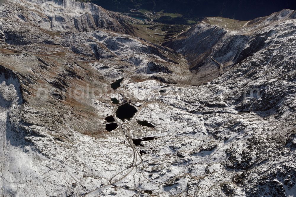 Airolo from the bird's eye view: Wintry snowy Rock and mountain landscape at the valley to the St Gotthard Pass in Airolo in the canton Ticino, Switzerland