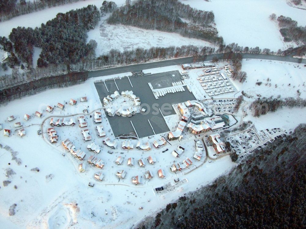 Aerial image Kleinzerlang - Wintry snowy holiday house plant of the park Marina Wolfsbruch in Kleinzerlang in the state Brandenburg, Germany