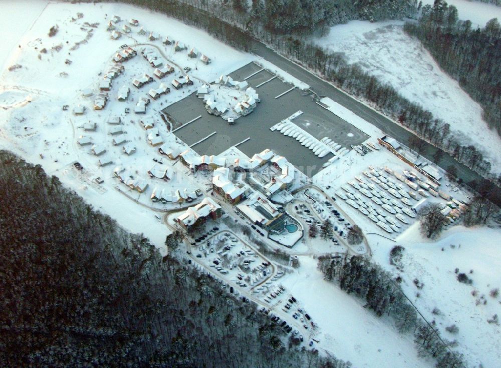 Kleinzerlang from above - Wintry snowy holiday house plant of the park Marina Wolfsbruch in Kleinzerlang in the state Brandenburg, Germany