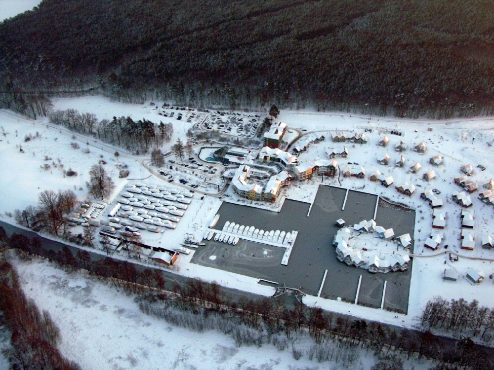 Aerial image Kleinzerlang - Wintry snowy holiday house plant of the park Marina Wolfsbruch in Kleinzerlang in the state Brandenburg, Germany