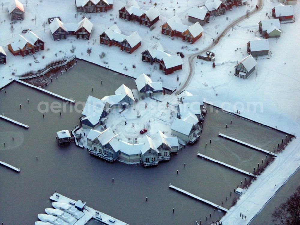 Aerial photograph Kleinzerlang - Wintry snowy holiday house plant of the park Marina Wolfsbruch in Kleinzerlang in the state Brandenburg, Germany