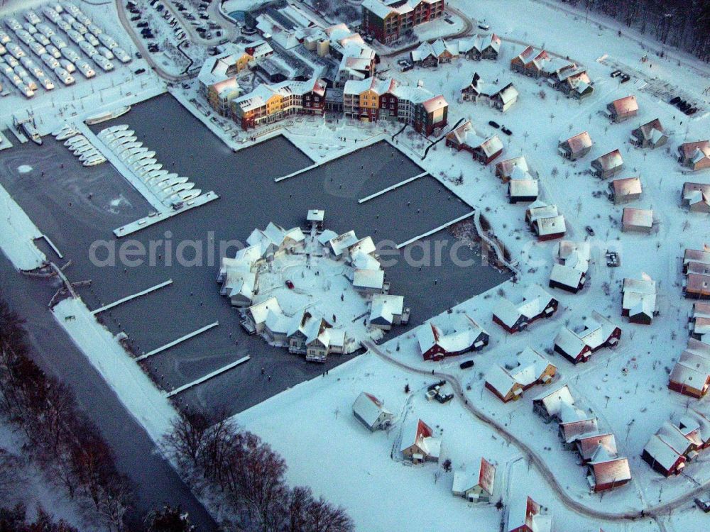 Kleinzerlang from above - Wintry snowy holiday house plant of the park Marina Wolfsbruch in Kleinzerlang in the state Brandenburg, Germany